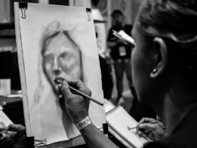 grayscale photo of man smoking cigarette